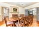 Dining room with hardwood floors, fireplace, and views into other rooms at 704 Little Creek Dr, Kings Mountain, NC 28086