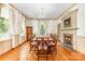Formal dining room with hardwood floors, fireplace, and ample natural light at 704 Little Creek Dr, Kings Mountain, NC 28086