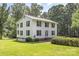 Two-story home featuring a spacious lawn, double-stacked porches, and mature trees at 704 Little Creek Dr, Kings Mountain, NC 28086
