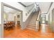 Bright foyer featuring hardwood floors, a staircase, and access to other rooms at 704 Little Creek Dr, Kings Mountain, NC 28086