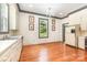 Bright kitchen with hardwood floors, white cabinets, and a large window at 704 Little Creek Dr, Kings Mountain, NC 28086