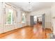 Bright living room with hardwood floors, fireplace, and natural light from large windows at 704 Little Creek Dr, Kings Mountain, NC 28086