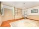 Bright living room with a custom built-in bookcase and hardwood floors at 704 Little Creek Dr, Kings Mountain, NC 28086