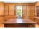 Bright office with a large wooden desk and a view of the trees outside the window at 704 Little Creek Dr, Kings Mountain, NC 28086