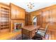 Traditional office with wood paneling, built-in bookshelves, and fireplace at 704 Little Creek Dr, Kings Mountain, NC 28086