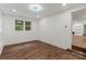 This bedroom features wood floors, recessed lighting, and a doorway to another room at 704 W Border St, Dallas, NC 28034