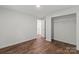 Bedroom with laminate flooring, a closet, and a door to another room at 704 W Border St, Dallas, NC 28034