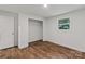 This bedroom features sleek wood floors, a well-lit closet, and a window with a lush view at 704 W Border St, Dallas, NC 28034