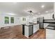 A modern kitchen featuring stainless appliances, sleek countertops, a geometric black island, and an open concept design at 704 W Border St, Dallas, NC 28034