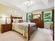 Lovely bedroom with tray ceiling, ceiling fan, nice furniture, and bright windows at 7300 Bailywick Dr, Waxhaw, NC 28173