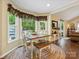 Bright dining area features a quaint breakfast nook with backyard views and a pool at 7300 Bailywick Dr, Waxhaw, NC 28173