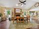 Bright dining room with vaulted ceilings, fireplace, and backyard views at 7300 Bailywick Dr, Waxhaw, NC 28173