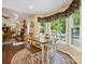 Dining room with natural light and a view of the backyard pool and outdoor deck at 7300 Bailywick Dr, Waxhaw, NC 28173