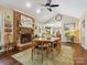 Cozy dining room with brick fireplace and plenty of natural light at 7300 Bailywick Dr, Waxhaw, NC 28173