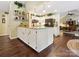 Spacious kitchen island featuring granite countertops, white cabinetry, and stylish decor at 7300 Bailywick Dr, Waxhaw, NC 28173
