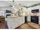 Modern kitchen with granite countertops, white cabinetry, and sleek, black appliances at 7300 Bailywick Dr, Waxhaw, NC 28173