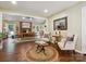 Open-concept living area with hardwood floors and abundant natural light at 7300 Bailywick Dr, Waxhaw, NC 28173