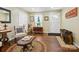 Cozy living room features hardwood floors, a rug, and ample seating at 7300 Bailywick Dr, Waxhaw, NC 28173