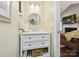 Charming powder room with decorative mirror, soft lighting, and decorative soaps at 7300 Bailywick Dr, Waxhaw, NC 28173