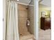 Tiled shower with glass door and rain shower head at 7300 Bailywick Dr, Waxhaw, NC 28173