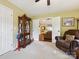 This inviting sitting room with neutral carpet features a comfortable recliner and decor at 7300 Bailywick Dr, Waxhaw, NC 28173