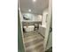 Primary bathroom with soaking tub, gray tile accent, and a modern vanity at 734 Forestbrook Dr # 10, Gastonia, NC 28056