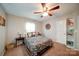 Comfortable bedroom featuring a ceiling fan, lamp, and side table at 734 Forestbrook Dr # 10, Gastonia, NC 28056