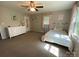 Bedroom with carpet, ceiling fan, a window with curtains, and a dresser at 734 Forestbrook Dr # 10, Gastonia, NC 28056