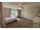 Bedroom with carpet, ceiling fan, and a statement tree wall decal at 734 Forestbrook Dr # 10, Gastonia, NC 28056