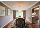 Charming dining room featuring crown molding, natural light and stylish decor with a view to the kitchen at 734 Forestbrook Dr # 10, Gastonia, NC 28056