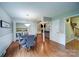 Dining room with hardwood floors, a modern chandelier, and four chairs at 734 Forestbrook Dr # 10, Gastonia, NC 28056