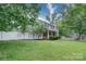 A charming two-story home is displayed with a white picket fence, a manicured lawn, and mature trees at 734 Forestbrook Dr # 10, Gastonia, NC 28056