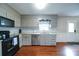 Kitchen with grey cabinets, stainless steel appliances, and hardwood flooring at 734 Forestbrook Dr # 10, Gastonia, NC 28056