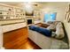 Inviting living room featuring hardwood floors, a comfortable sofa, and a brick fireplace at 734 Forestbrook Dr # 10, Gastonia, NC 28056