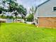 Large backyard with a patio, shed, and ample green space, great for outdoor activities and relaxation at 734 Forestbrook Dr, Gastonia, NC 28056