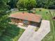 Aerial view of a well-maintained home with lush green lawn and mature trees at 888 Stowe Ln, Gastonia, NC 28056