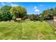 Large backyard with mature trees and outbuildings at 888 Stowe Ln, Gastonia, NC 28056