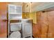 Bathroom featuring a toilet, sink and wood paneling at 888 Stowe Ln, Gastonia, NC 28056