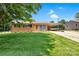Well-maintained home with an attached carport and a lush green lawn at 888 Stowe Ln, Gastonia, NC 28056