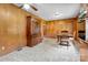 Vintage kitchen with paneled walls, classic cabinetry, and a dining area at 888 Stowe Ln, Gastonia, NC 28056
