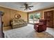 Inviting living room with a large window, neutral carpet, and a cozy seating area at 888 Stowe Ln, Gastonia, NC 28056