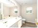 Bathroom features a double vanity, tub, tile floors, and a separate toilet area for added privacy at 9146 Austin Ridge Ln, Charlotte, NC 28214