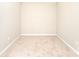 Simple bedroom with neutral walls, base molding, and carpeted floors for a clean and comfortable space at 9146 Austin Ridge Ln, Charlotte, NC 28214