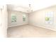 Spacious bedroom features a tray ceiling, neutral carpet, and great natural light from three large windows at 9146 Austin Ridge Ln, Charlotte, NC 28214