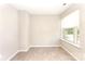Cozy bedroom boasts neutral carpet, fresh paint and a large window providing ample natural light at 9146 Austin Ridge Ln, Charlotte, NC 28214