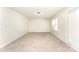 A bright bedroom features large windows for ample natural light and cozy carpeting at 9146 Austin Ridge Ln, Charlotte, NC 28214