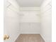 Walk-in closet with neutral carpet and shelving offers ample storage space for an organized wardrobe at 9146 Austin Ridge Ln, Charlotte, NC 28214