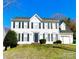 Charming two-story home with black shutters, a manicured lawn, and an attached two-car garage at 9146 Austin Ridge Ln, Charlotte, NC 28214