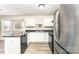 Efficient kitchen features stainless steel appliances, ample counter space and durable floors at 9146 Austin Ridge Ln, Charlotte, NC 28214