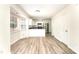 Well-lit kitchen features white cabinets, stainless steel appliances, and durable floors at 9146 Austin Ridge Ln, Charlotte, NC 28214